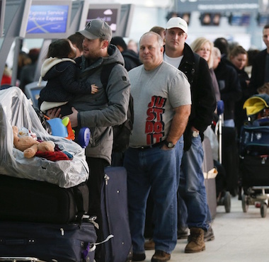 People waiting in line at an airport