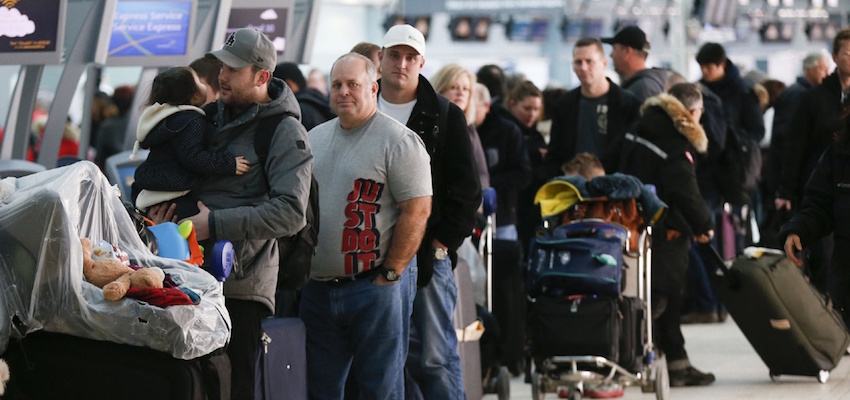 People waiting in line at an airport